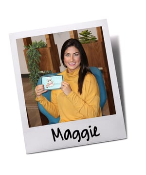 Employee holding Baudville personalized holiday ornament